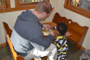 Sharing Daddy's breakfast